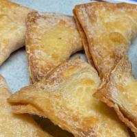 Crab Rangoon (6) · Cream cheese with crab meat wrapped in crispy skin.