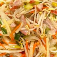 Pork Chop Suey Crispy Noodles · Pork cooked in a white sauce with green and white onions, bean sprouts, and carrots, served ...