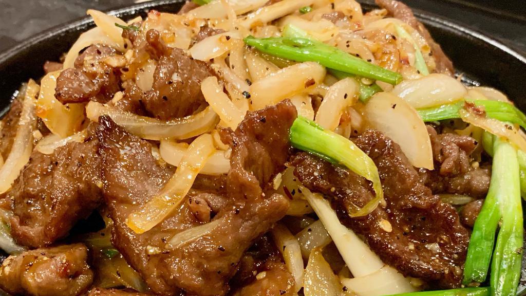 Sizzling Beef Strip Loin · Spicy. Sliced tender beef sautéed with green and white onion in pepper and garlic sauce.