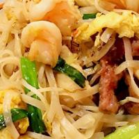 Pad Thai · Spicy. Stir fried rice noodles with bean sprouts, scallions and egg with chicken, beef and s...