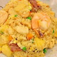 Pineapple Fried Rice · Spicy. Cashew nuts, pineapple, peas and carrots with chicken, beef and shrimp.
