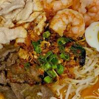 Singapore Laksa · Spicy. Noodles with chicken, beef and shrimp served in spicy curry with coconut milk.