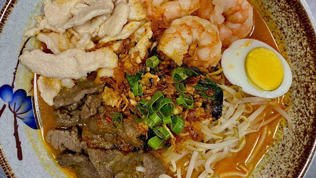 Singapore Laksa · Spicy. Noodles with chicken, beef and shrimp served in spicy curry with coconut milk.