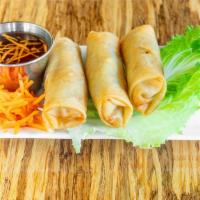 Crispy Spring Rolls · 3 pcs. Lightly fried rolls with minced shrimp, pork, taro, and vegetables. Served with nuoc ...