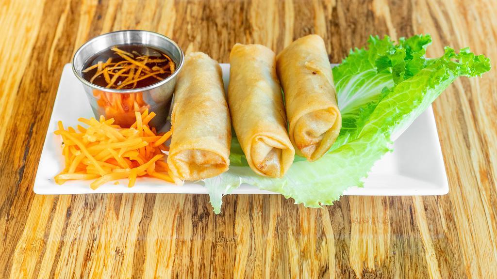 Crispy Spring Rolls · 3 pcs. Lightly fried rolls with minced shrimp, pork, taro, and vegetables. Served with nuoc mam sauce.