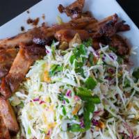 Chicken Cabbage Salad · Grilled chicken, mixed cabbage, fried shallots, and cilantro tossed in lime vinaigrette dres...