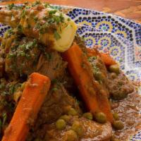 Tagine Of Spicy Lamb A La Carte · Hot. Served with roasted potatoes, peas & carrots in a tomato cumin garlic sauce.