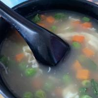 Egg Drop Soup · Traditional soup with peas, carrots, egg and scallion.
