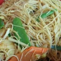 Traditional Singapore Noodle · Spicy. Angel hair rice noodle cooked with egg and basic vegetables with yellow curry powder....