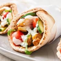Chicken Shawarma · Perfectly seasoned and grilled chicken with homemade tzatziki, hummus, garlic sauce and fres...