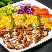 Chicken Shawarma Plate · Served with rice salad grilled vegetables fries hummus tzatziki sauce and pita bread.