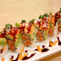 Sumo Roll · Shrimp tempura, spicy crab, cucumber topped with a layer of avocado, spicy salmon and scalli...