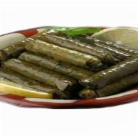 Dolma Grape Leaves Plate · Grape leaves stuffed with rice, tomatoes, onion and parsley cooked with seasoning.