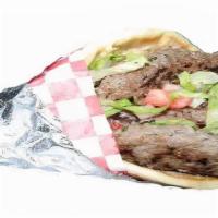 Kafta Gyro · Ground beef, tomatoes, pickles, lettuce, onions, parsley and hummus.