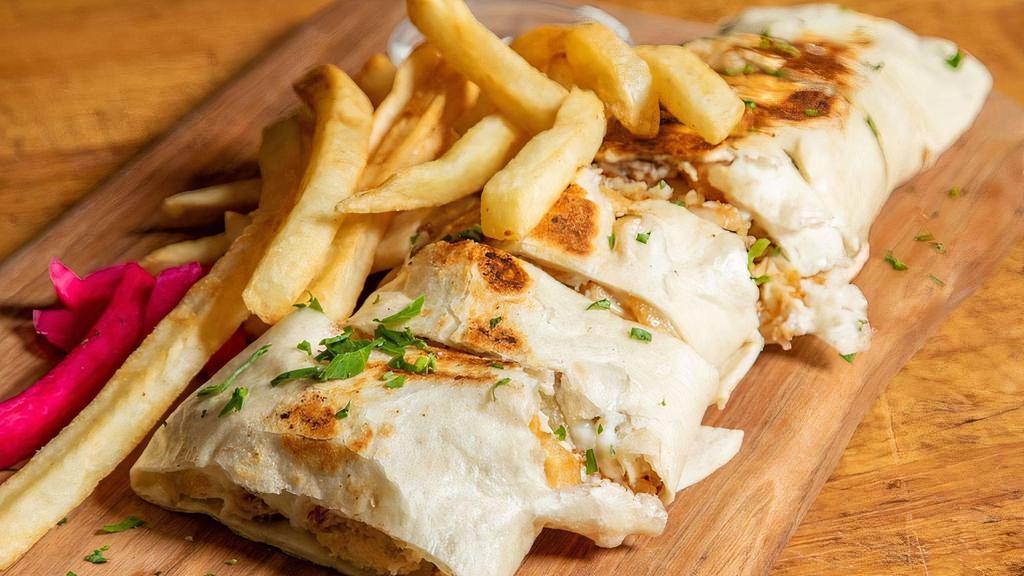 Chicken Arabi With Fries · Chicken shawarma Arabi warped in saj bread. Cut to small bite size pieces and served on a bed of fries.