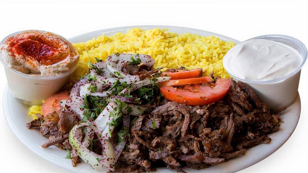 Beef Shawarma Plate · Marinated beef, served with rice, mix salad, tzatziki, hummus mix spicy garlic sauce.
