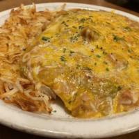 Huevos Rancheros · Three eggs served over corn tortillas, green chili and cheese. Includes a side of breakfast ...