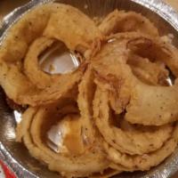 Basket Of Beer Battered Onion Rings · Full basket of fresh hand-cut onion rings dipped in a beer batter. Served with chipotle ranch.