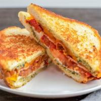 Guy'S Grilled Cheese · Three slices of thick hickory-smoked bacon, Provolone, cheddar cheese, tomato, and pesto on ...