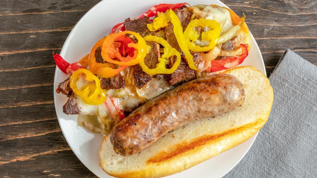 Mega Meat · House-made italian beef and a full italian sausage link with sauted bell peppers and onion, mozzarella, and sweet heat banana peppers on toasted Italian bread.