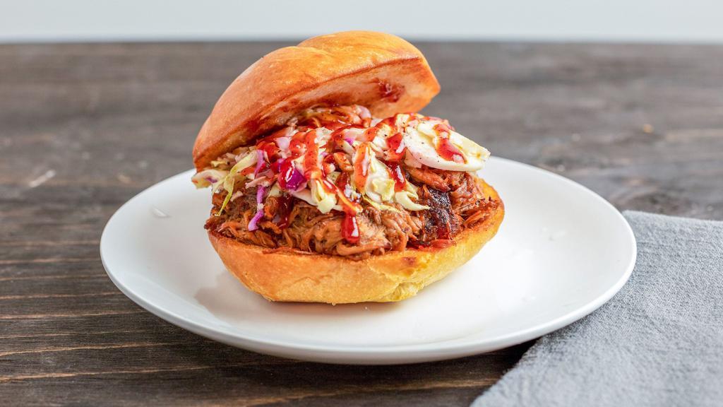 Mega Bbq Pork Bomb · House made, slow-roasted pork with BBQ sauce, coleslaw, and dill pickle on brioche