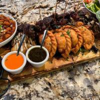 Turf Tabla* · Lamb chops, beef skewers, grilled chorizo, pineapple chicken wraps, bacon wrapped dates, emp...