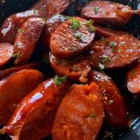 Chorizo Sausage · Spicy mini chorizo paprika sausage grilled & served on house made bread
