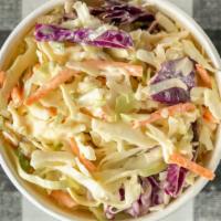 Cabbage Slaw · Shredded cabbage, carrots, and purple cabbage with house made slaw sauce