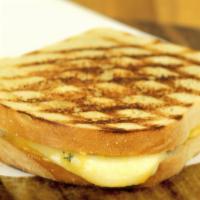 Grilled Cheese Panini · A twist on the traditional. Served with garlic herb spread, cheddar cheese, and Swiss cheese...