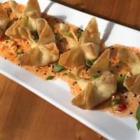 Dungeness Crab Wontons · Fresh Dungeness crab, goat and cream cheese, chives, spices & dill in 6 crispy wontons. Thai...