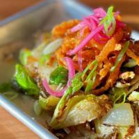 Fried Brussels Sprouts · Flash fried & topped w/ crispy onion straws, Parmesan & pickled red onion.