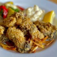 Fried Oysters · Fresh oysters seasoned w/ our own spice blend, lightly breaded & fried golden. Served w/ sea...