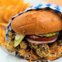 Fried Oyster Sandwich · Cajun fried Willapa bay oysters on a toasted brioche bun w/ cabbage, tomato, red onion, pick...