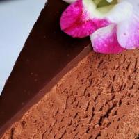 Triple Chocolate Mousse Cake · Belgium chocolate mousse on Oreo cookie crust topped w/ chocolate ganche. Served w/ chocolat...