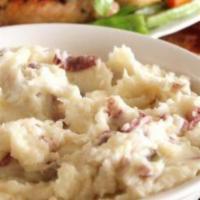 Garlic Mashed Potatoes · Red potatoes mashed w/ fresh garlic, butter & cream