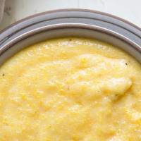 Mascarpone Polenta · Creamy yellow corn polenta w/ fresh herbs, spices, cream, Parmesan & Mascarpone