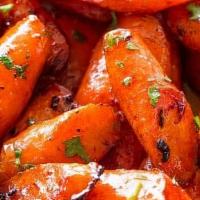 Honey Ginger Roasted Carrots · Buttered carrots slow roasted w/ our Honey ginger-lime spice and fresh rosemary