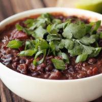 Chipotle Black Beans · Black beans simmered w/ peppers, onions, tomatoes, SW spices & herbs topped w/ Cotija cheese