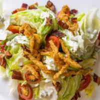 Wedge Salad · Baby iceberg, grape tomato, peppered bacon, blue cheese crumbles, crispy onions, blue cheese...