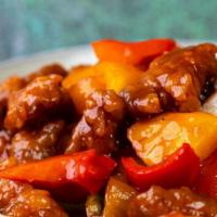 Sweet & Sour Pork · Prepared with pineapples, bell peppers and onions and carrots.