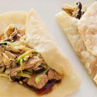 Mu Shu Pork · Prepared with cabbage, egg, bamboo shoots and rolled into Chinese crepes.