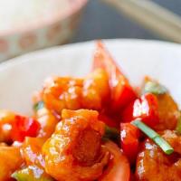Sweet & Sour Chicken · Prepared with pineapples, bell peppers and onions and carrots.