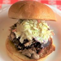 Carolina Pulled Pork · Pulled pork, sauce, and topped with cole slaw.