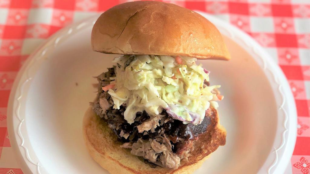 Carolina Pulled Pork · Pulled pork, sauce, and topped with cole slaw.