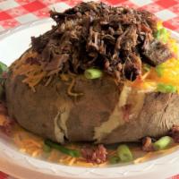 Loaded Tater With Meat · Giant potato stuffed with butter, sour cream, cheddar cheese, bacon bits, chives, and choice...