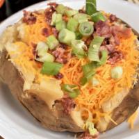 Loaded Tater · Giant potato stuffed with butter, sour cream, cheddar cheese, bacon bits, and chives.
