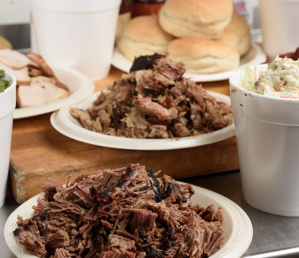 #4 Family Pack (Feeds 16) · 4 lbs. of meat, 4 quarts of sides, 16 buns, and sauce.