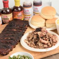 Family Feast (Feeds 6-8) - 1 Meat Choice · 1 slab of ribs, 1 lb. of meat - 1 meat choice, 3 pints of sides, 4 buns, and sauce.