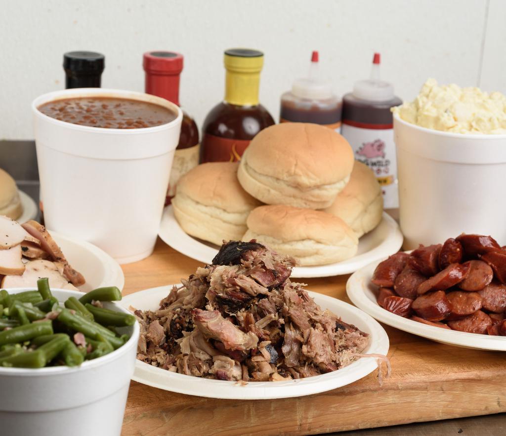 #3 Family Pack (Feeds 12) · 3 lbs. of meat, 3 quarts of sides, 12 buns, and sauce.