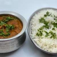 Lamb Curry · A traditional south Indian dish cooked with lamb and tomato-chile sauce. Served with rice an...